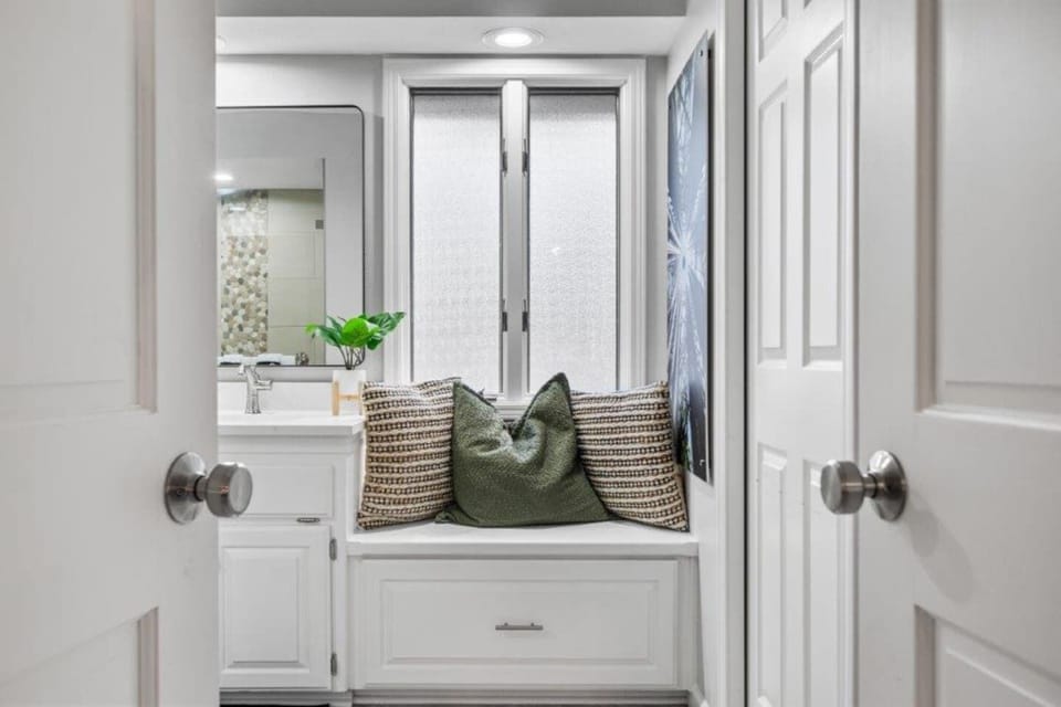 Double Doors open to the Ensuite Bathroom.  The Large Walk-in Closet it to the Right. 