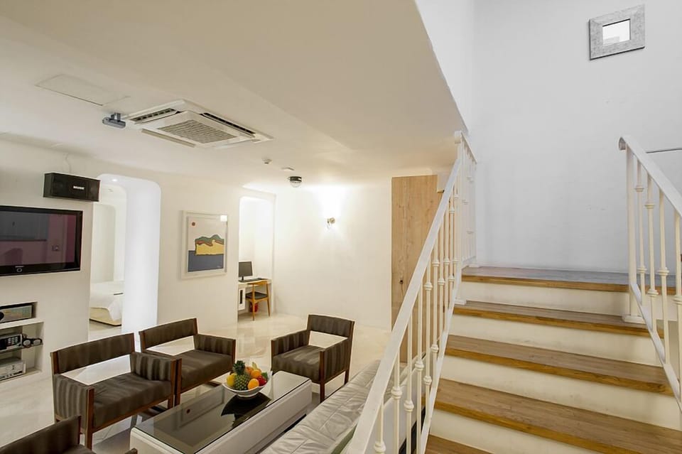 Royal Studio Suite, 1 Queen Bed, Private Pool, Mezzanine | Living room | Flat-screen TV, heated floors