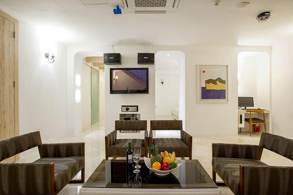 Royal Studio Suite, 1 Queen Bed, Private Pool, Mezzanine | Living area | Flat-screen TV, heated floors