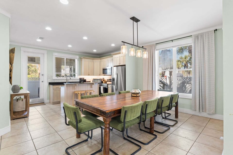 The dining room sits just off the kitchen and features a large table that seats eight comfortably.
