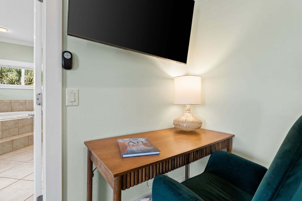 A writing desk offers a convenient spot for catching up on emails or planning your day.