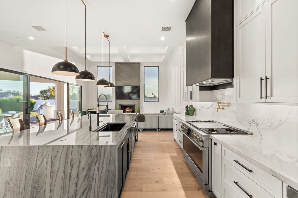Spacious kitchen layout with premium appliances and marble finishes.