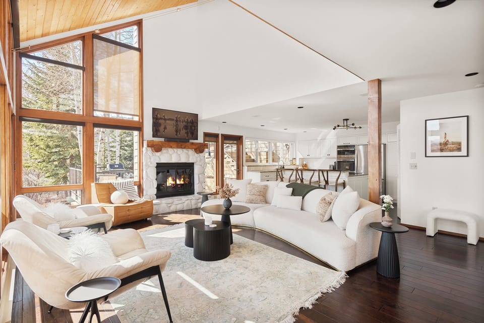 Spacious and light-filled living/dining/kitchen on the second floor of this gorgeous multi-tiered home. Enjoy views looking down at the Brush Creek Valley and the Snowmass Club.