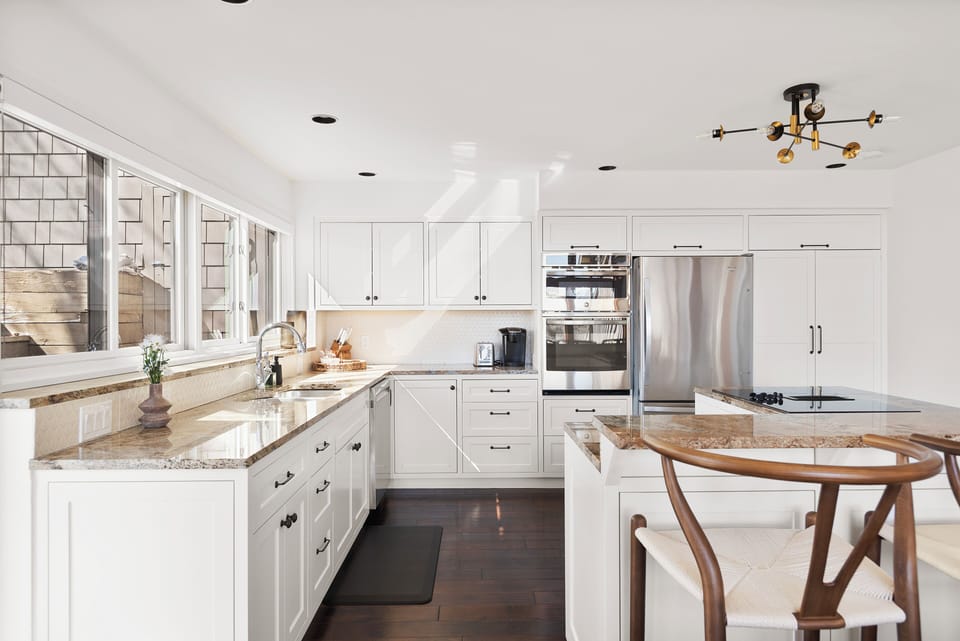 Beautiful kitchen with new stainless steel appliances and views of the valley beyond.