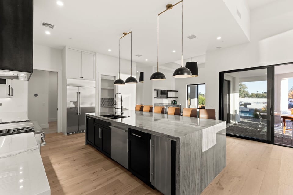 Open kitchen designed for effortless hosting and indoor-outdoor dining.