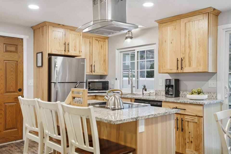Spacious kitchen with bar seating and ample counter space