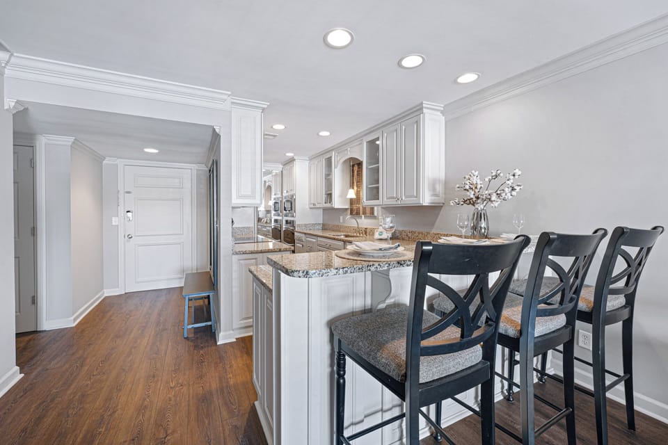 The open layout makes it easy to gather, cook, and connect while enjoying the comfortable flow between the kitchen, dining space, and living area.