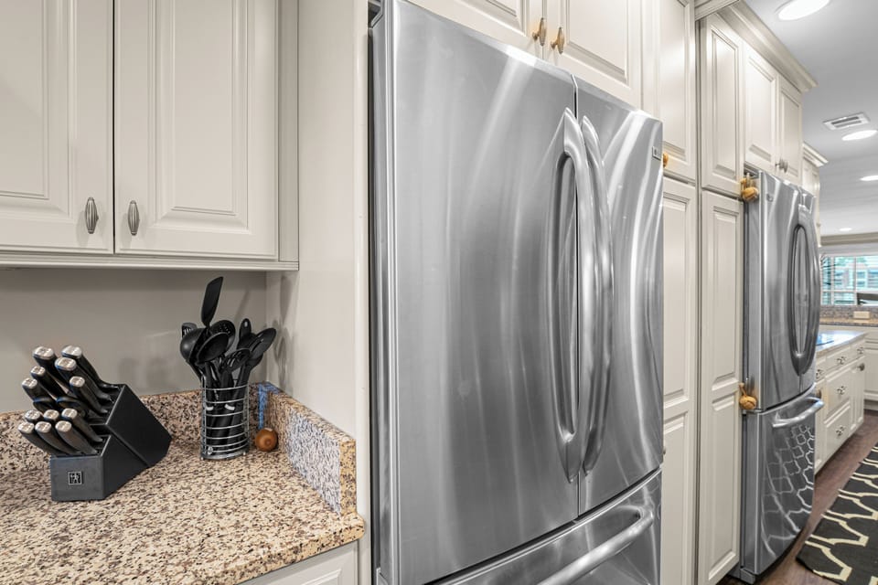 Everything you need—from cookware to utensils—is conveniently arranged, creating a functional and welcoming space for cooking and gathering.