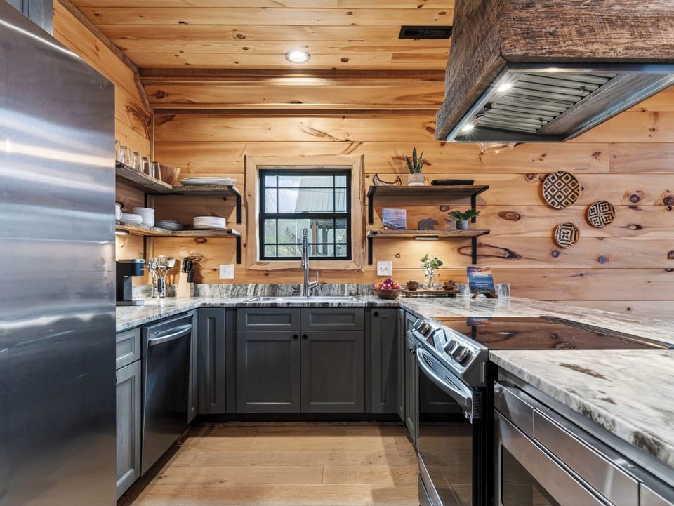 Well-equipped kitchen with a large island, bar seating, and plenty of room to cook together.