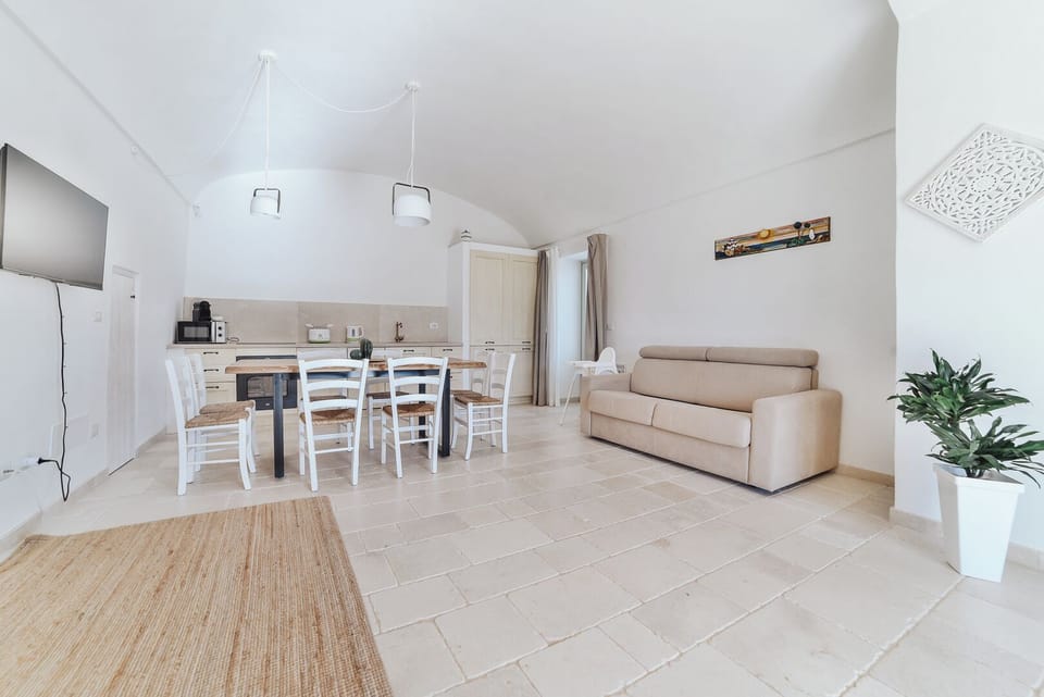 Family Apartment, Patio, Garden View | Living area | 40-inch flat-screen TV with cable channels