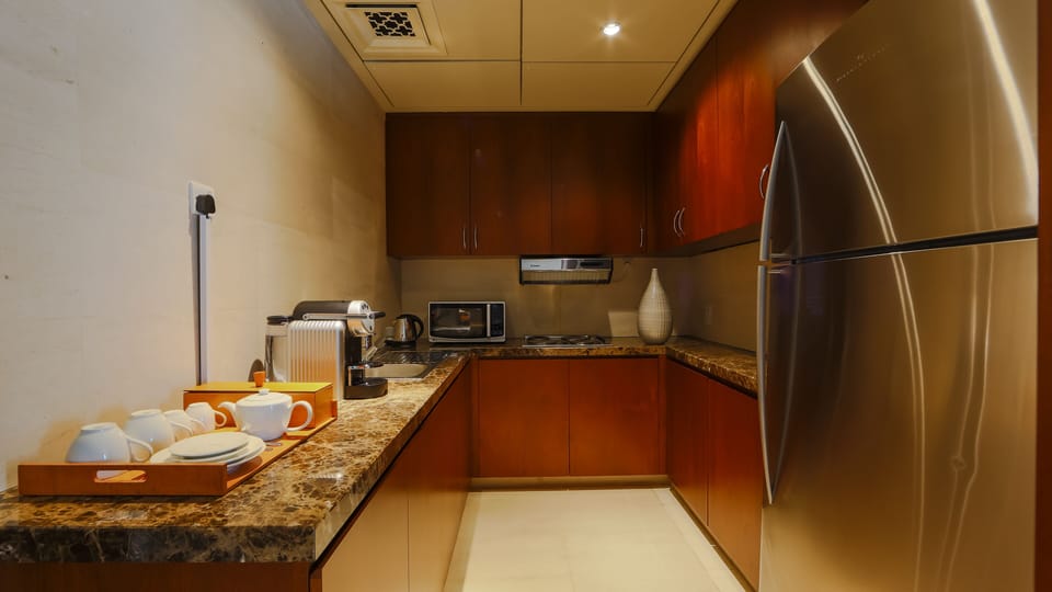 Presidential Suite | Private kitchen | Coffee/tea maker, dining table