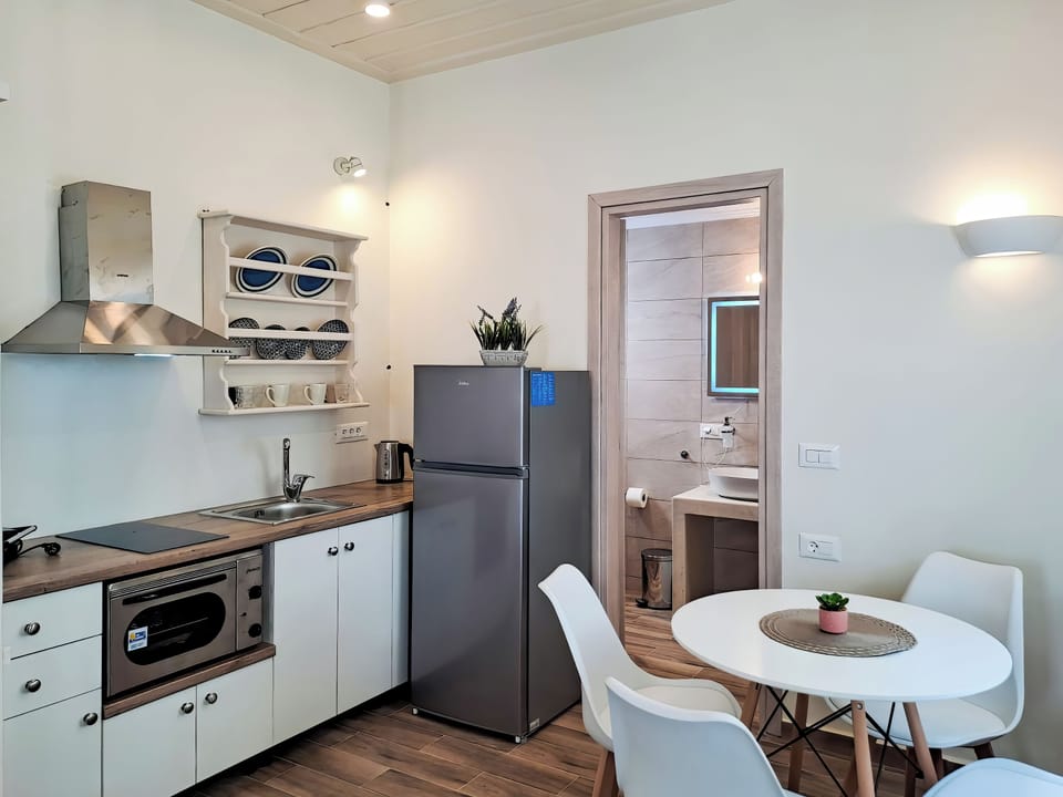 Superior Studio, Partial Sea View | Private kitchen | Fridge, stovetop, coffee/tea maker, electric kettle
