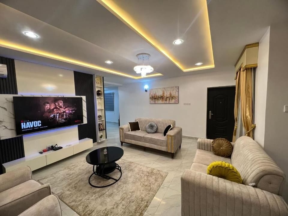 Family Apartment, Balcony, City View | Living area | Flat-screen TV