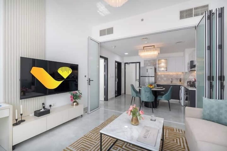 Luxury Apartment, Balcony, City View | Living area | 65-inch Smart TV with cable channels, foosball, table tennis