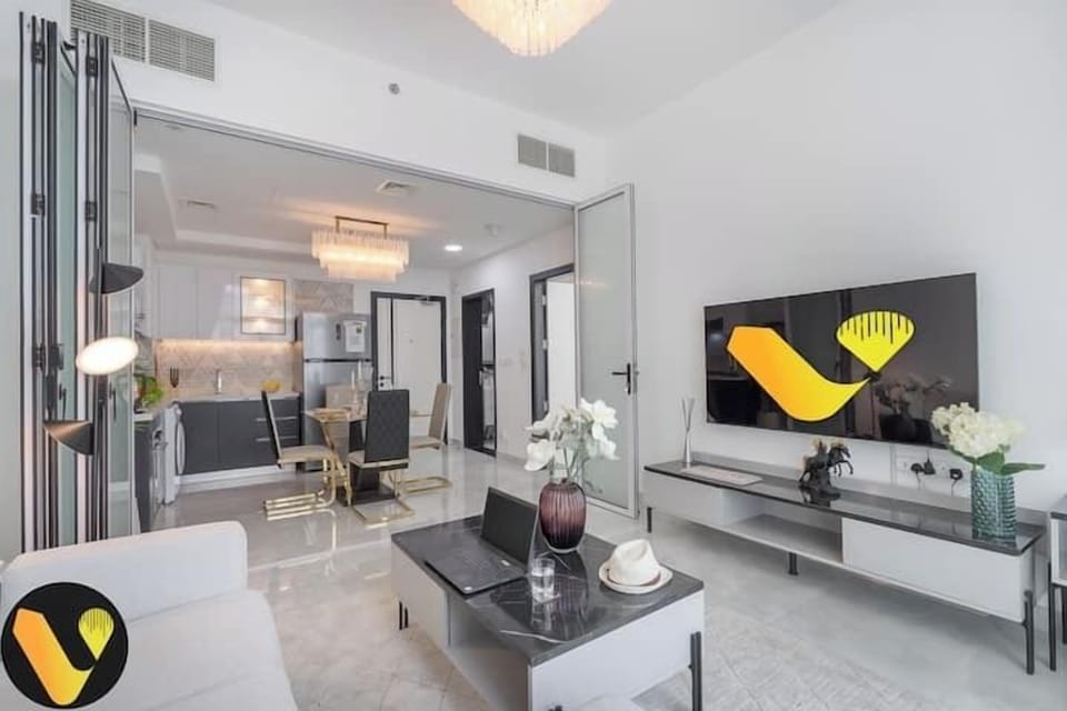 Luxury Apartment, Balcony, City View | Living area | 65-inch Smart TV with cable channels, foosball, table tennis