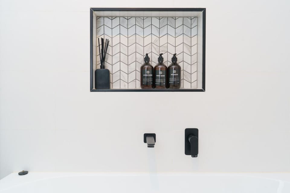 This bathroom offers both functionality and a sleek, minimalist feel.