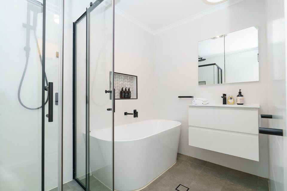 Spotlessly clean bathroom with contemporary fittings and a refreshing shower experience.
