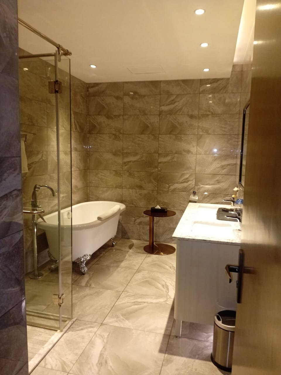 Family Studio Suite | Bathroom | Rainfall showerhead, hair dryer (on request), slippers, towels