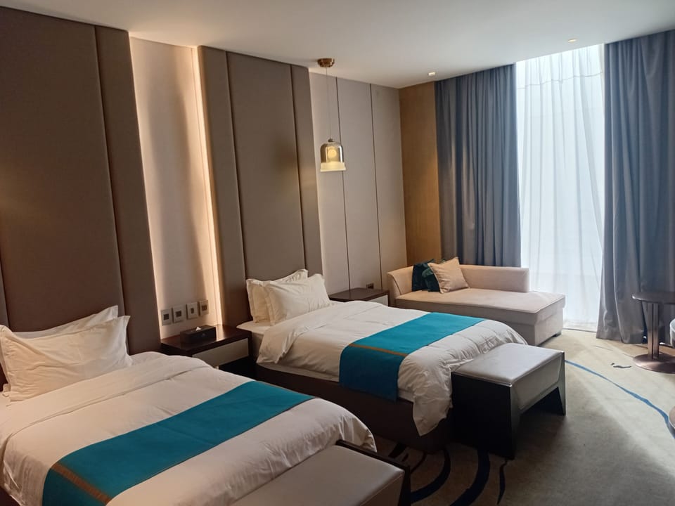 Economy Twin Room | Minibar, in-room safe, desk, laptop workspace