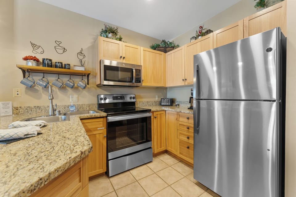 Your fully equipped kitchen features granite countertops, stainless steel appliances, and all the essentials for preparing memorable meals together.