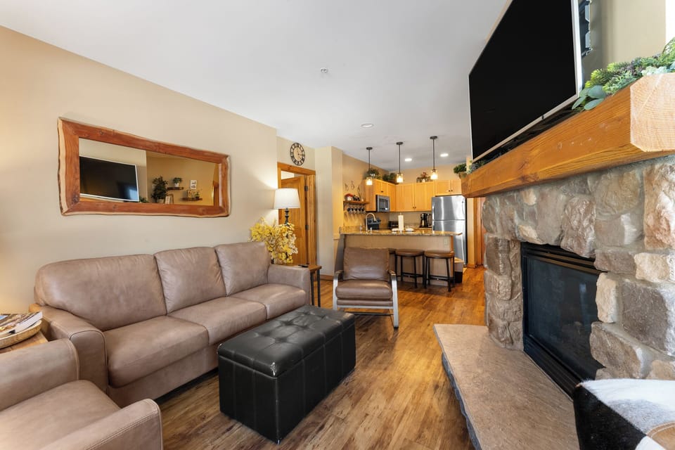 Unwind on plush leather sofas by your stone fireplace, with the fully equipped kitchen perfect for home-cooked meals.