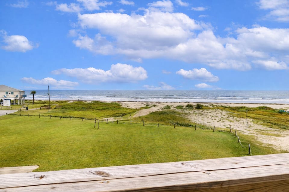 Scenic view of coastal dunes and beach landscape from the property.