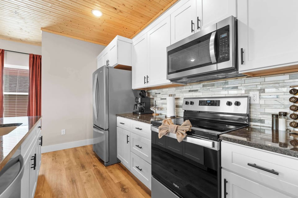 The open kitchen offers ample space & all the comforts of home​