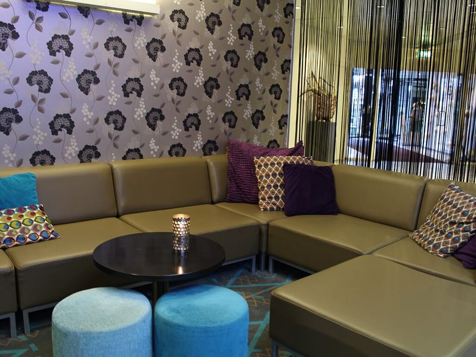 Sink into plush seating with soft lighting and intimate vibes