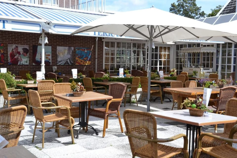 Unwind under oversized umbrellas with breezy terrace dining.