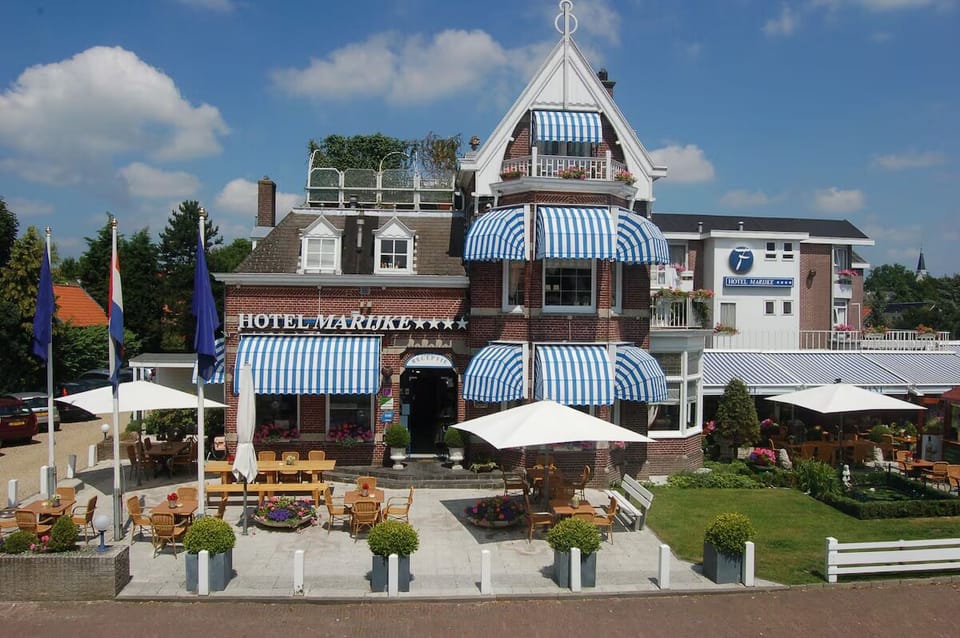 Step into classic charm with a welcoming, iconic hotel facade.