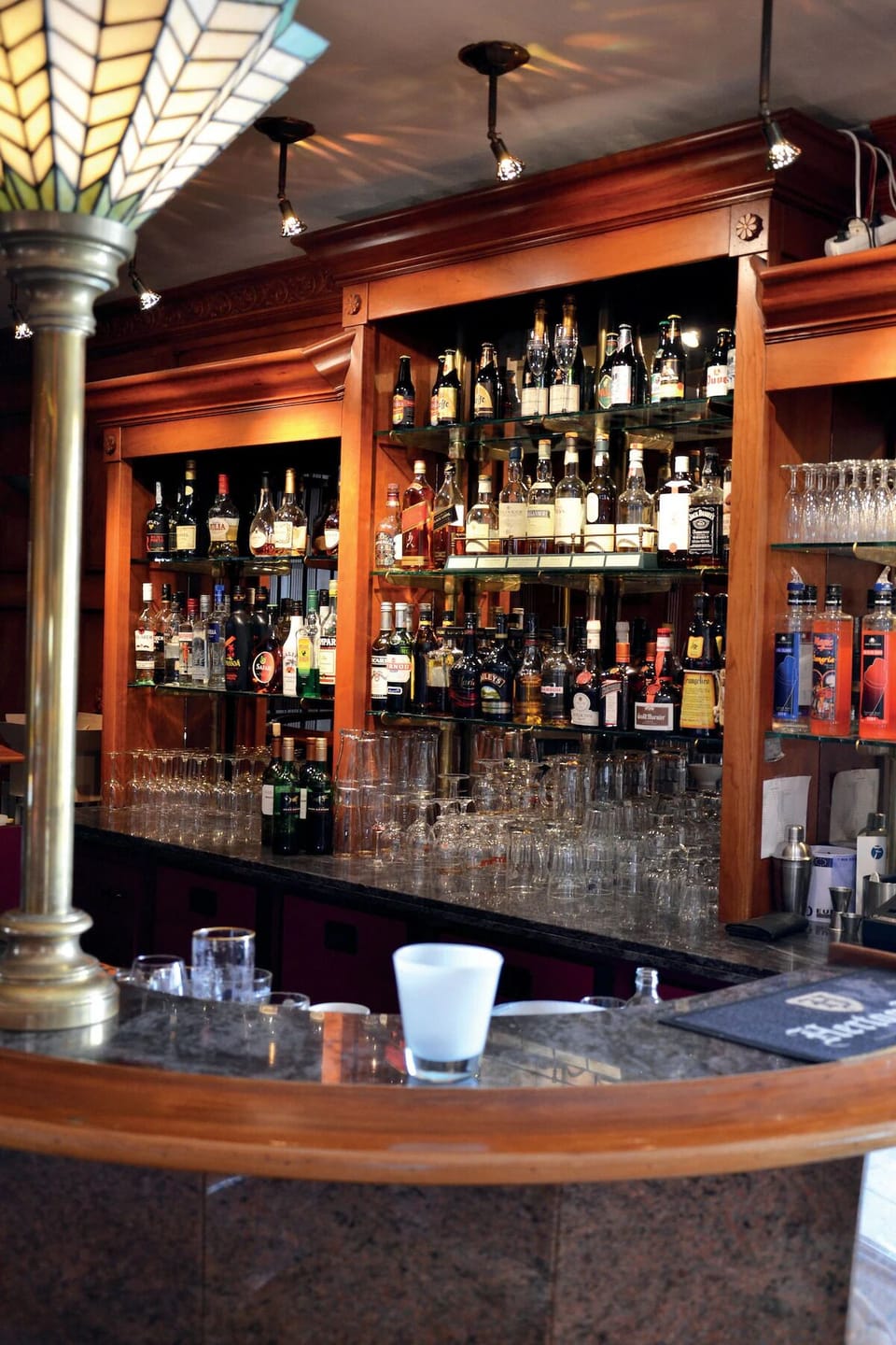 Sip a nightcap at the polished bar with premium spirits.