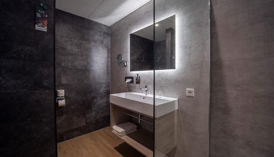 Indulge in a spa-like sink area with soft backlit glow.