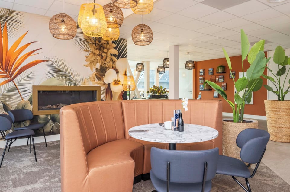 Settle in for coffee beneath warm, designer pendant lights.