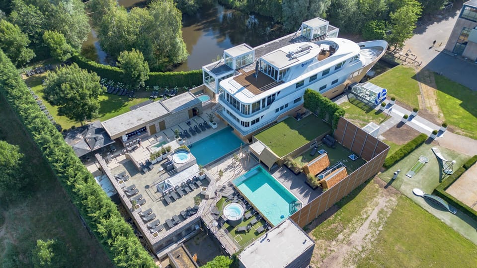 Discover a private resort oasis from above, surrounded by nature.