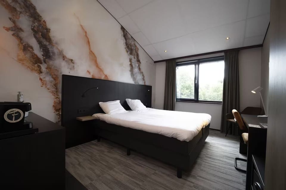 Unwind in crisp linens beside calming views and soft light.