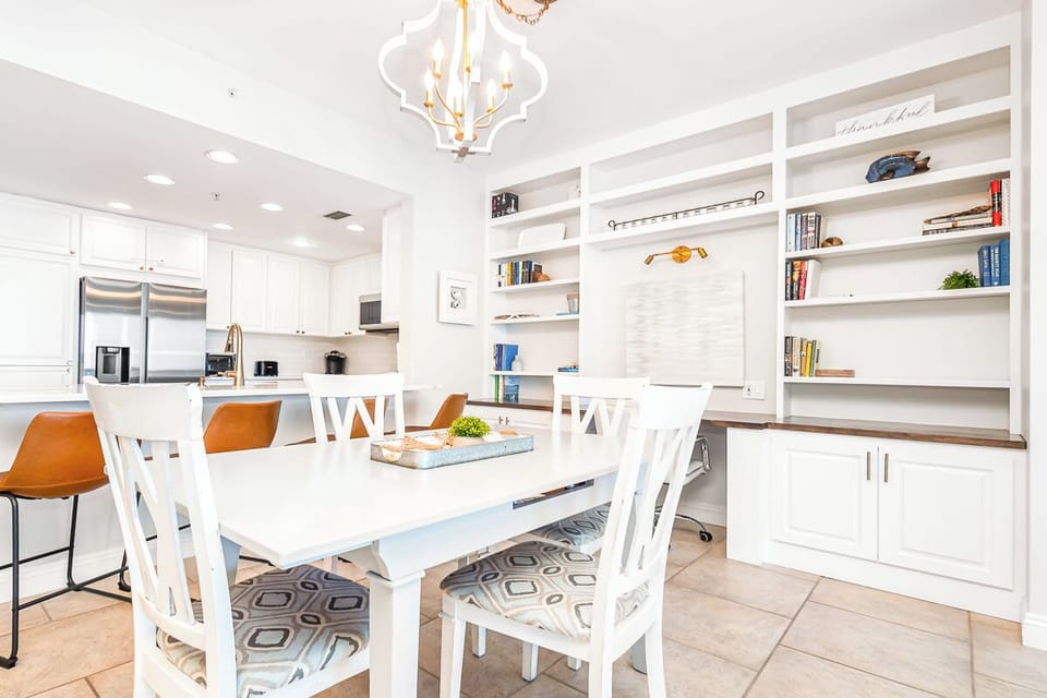 Your bright, open dining space flows seamlessly into the fully-equipped kitchen, perfect for memorable meals together.