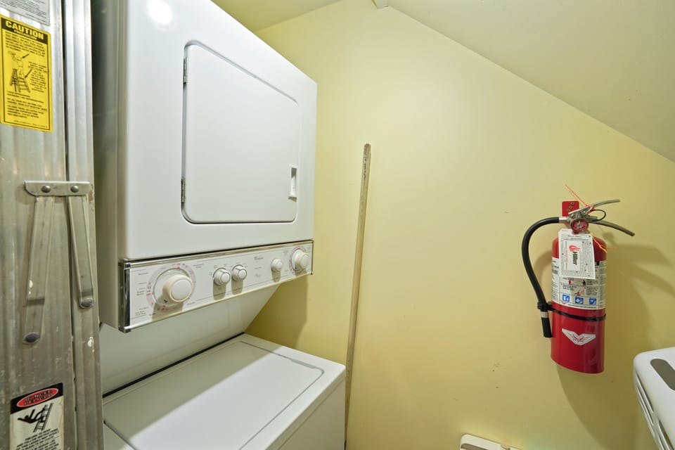 CLOSET WITH STACKED WASHER AND DRYER