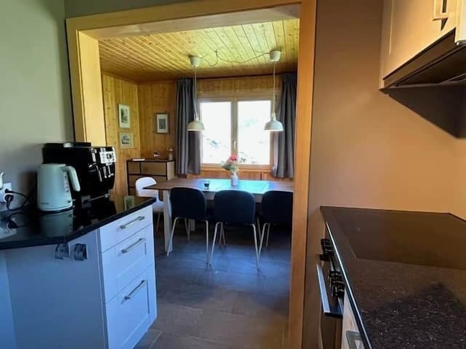 Well-equipped kitchen opening directly onto the welcoming dining area.