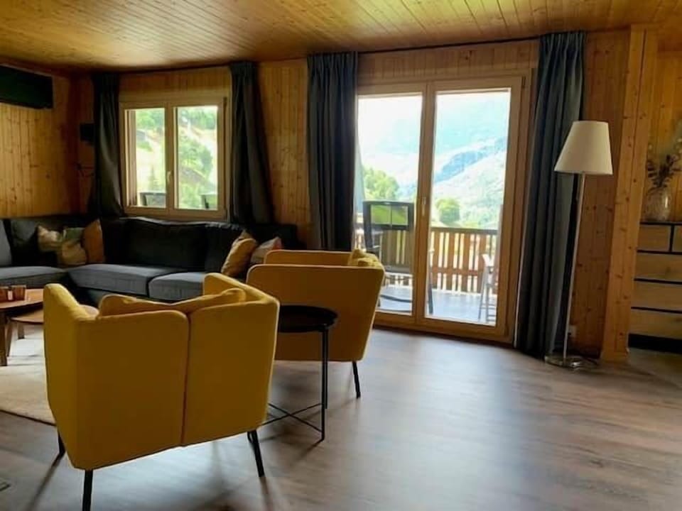 Step straight from the living room onto the spacious balcony overlooking the valley and mountains.