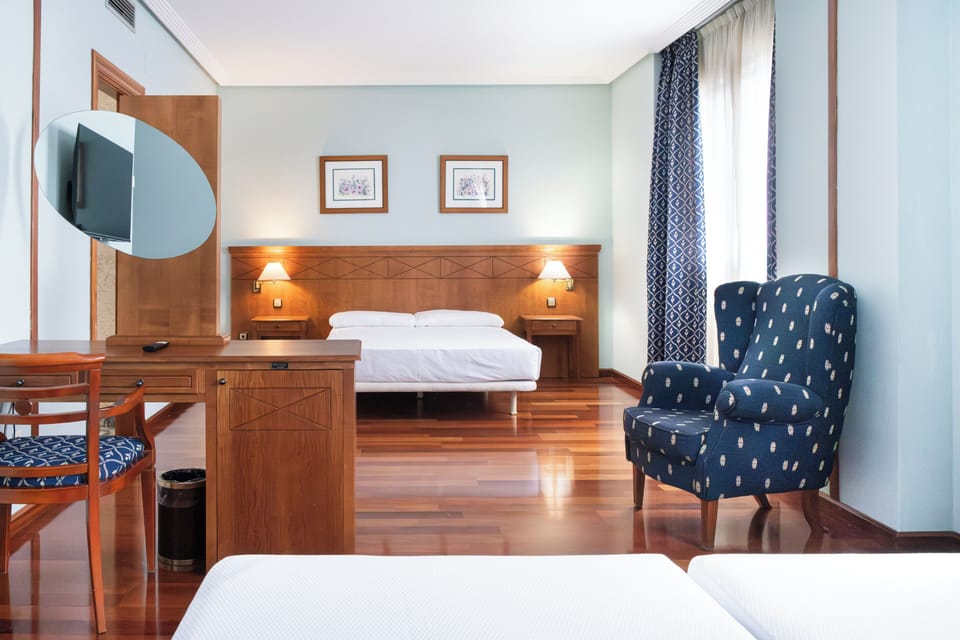 Desk, laptop workspace, free WiFi, bed sheets