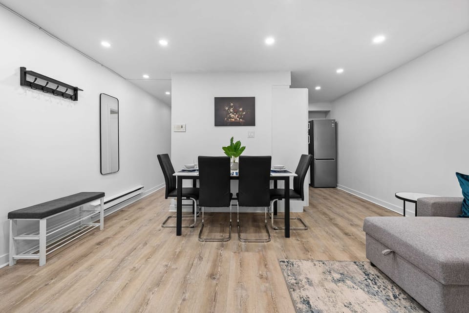 Dining area with a modern table and chairs, seamlessly connected to the living space.