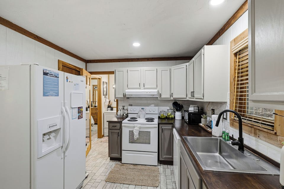 Your fully equipped kitchen awaits with modern appliances, ample counter space, and everything you need to create delicious home-cooked meals during your stay.