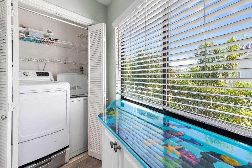 Convenient in-unit laundry with a bright coastal touch