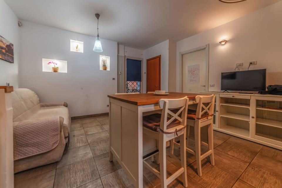 Condo, Garden View | Living area | Flat-screen TV