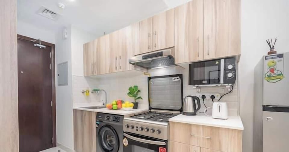 Luxury Studio, Balcony, City View | Private kitchen | Full-size fridge, microwave, oven, stovetop