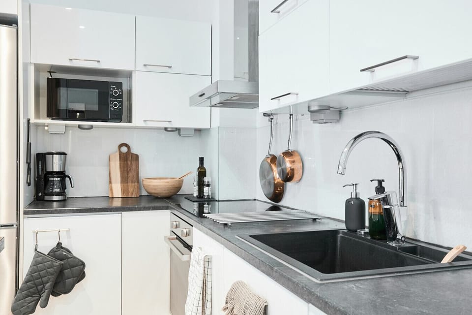 Brew your morning coffee or whip up a quick snack with the modern microwave and high-quality appliances at your fingertips.