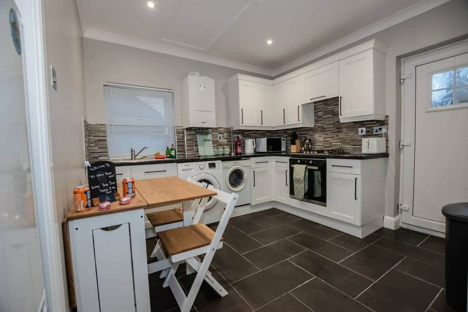 Spacious kitchen with dining area — perfect for meals or work stays