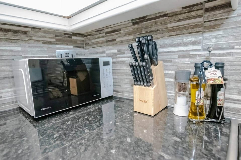 Well-equipped kitchen with modern appliances and essentials provided