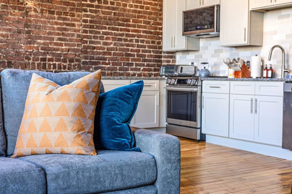 Living Room: Chic design meets gourmet kitchen vibes in this stylish urban retreat!