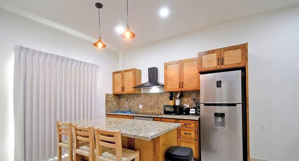 Have a seat at the breakfast bar to enjoy a bite to eat